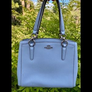 Slightly used light blue coach purse.